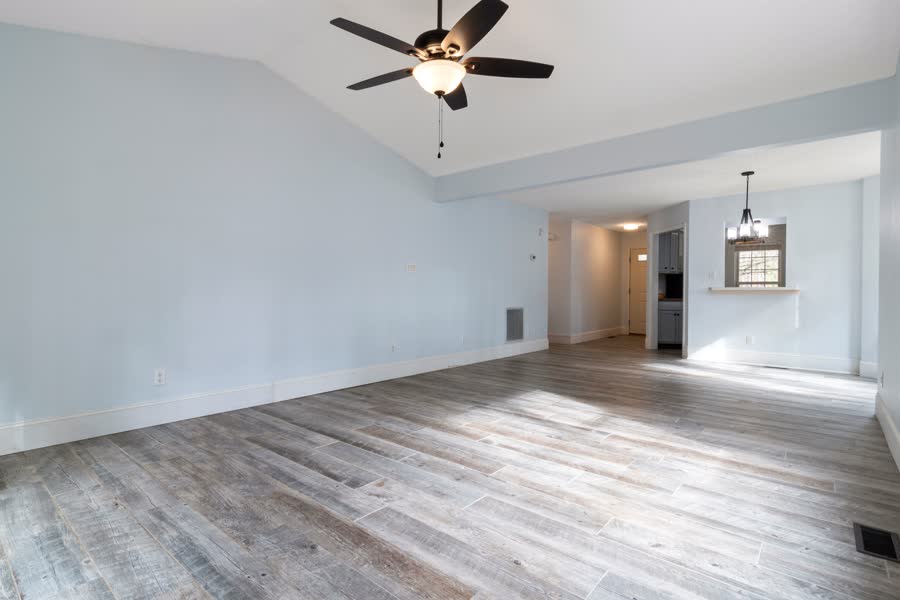 A clean, bright, empty living room ready for a tenant to move into